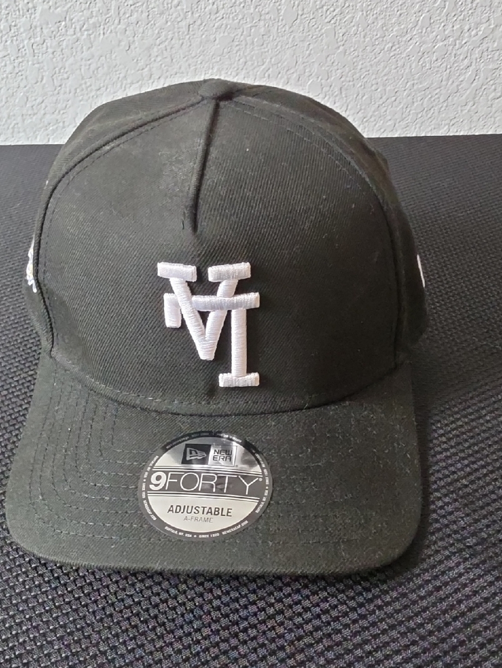 New Era Black Cap with White Raised Logo